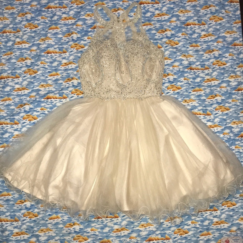 Used formal dress size XS. Champagne color sequin.